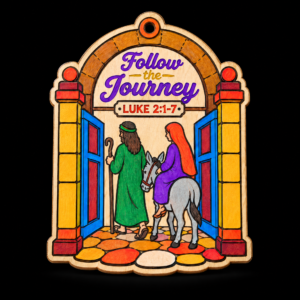 Follow the Journey hand-painted wooden Christmas ornament featuring Mary and Joseph traveling with a donkey and Luke 2:1-7.
