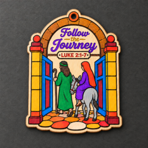 Painted Follow the Journey wooden gate Christmas ornament with colorful details on a charcoal background.
