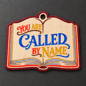 Painted You Are Called by Name Bible ornament with bright blue, orange, and yellow lettering and a red outline.